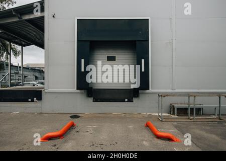 Closed door of transport terminal for truck deliveries and loading. Stock Photo