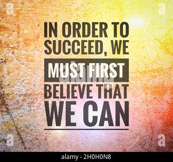 Quote. In order to succeed we must first believe that we can. Stock Photo