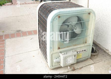 Old residential home air conditioner system compressor Stock Photo