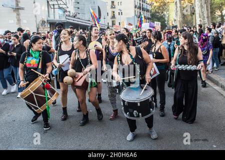 Barcelona, Spain. 12th Oct, 2021. Protesters perform during the protest.Various anticolonialist groups have called a demonstration that left the Ramblas of Barcelona to the statue of Christopher Columbus, with the slogans 'they will not conquer us' and 'nothing to celebrate'. The groups protested against the celebration of October 12, Hispanic Day. Various cultural presentations and performances of native peoples from Latin American and African countries have been carried out. Credit: SOPA Images Limited/Alamy Live News Stock Photo