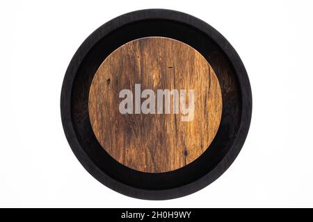 Two-color round wooden tea tray. Round wooden chopping board. Texture of old wooden planks. Stock Photo