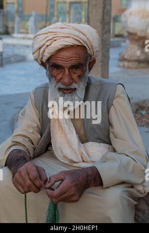 Close up of an old man at the Ahmad Shah Durrani mausoleum, Kandahar, Afghanistan Stock Photo