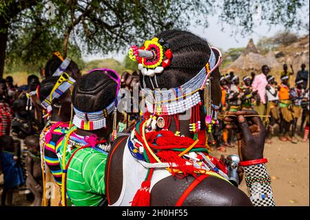 Traditional dressed young girls practising local dances, Laarim tribe, Boya hills, Eastern Equatoria, South Sudan Stock Photo