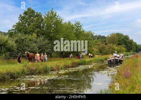 Restored towboat, horse-drawn barge, tugboat, travelling with tourists on the old Ludwig-Danube-Main Canal near the municipality of Burgthann, Middle Stock Photo