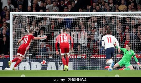 London, UK. 12th Oct, 2021. Hungary's Roland Sallai (1st L) scores his team's goal from the penalty spot during the FIFA World Cup Qatar 2022 qualification group I match between England and Hungary in London, Britain on Oct. 12, 2021. Credit: Matthew Impey/Xinhua/Alamy Live News Stock Photo