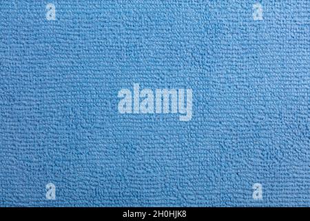 Microfiber Towel Blue Terry Texture Wrist Watch. Microfiber cloth with close-up. Fabric structure background. Fabric blue pattern. Cleaning service. M Stock Photo