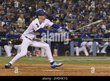 Los Angeles, United States. 12th Oct, 2021. Los Angeles Dodgers pitcher Walker Buehler hits and is safe at first on an error in the 4th inning against the San Francisco Giants in game four of the MLB NLDS at Dodger Stadium in Los Angeles, California on Tuesday, October 12, 2021. Photo by Jim Ruymen/UPI Credit: UPI/Alamy Live News Stock Photo