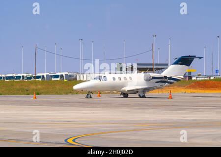 Airplane is parked near gate of airport terminal Stock Photo