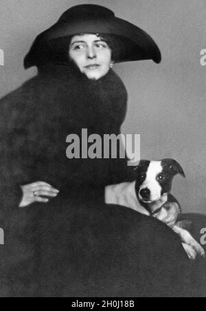 Portrait of a woman from 1921 with her dog. [automated translation] Stock Photo