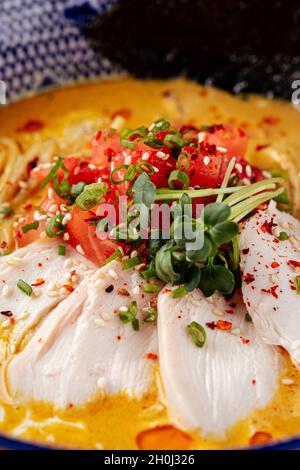Japanese curry chicken ramen with tomatoes Stock Photo