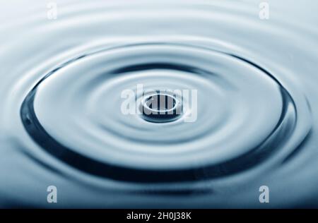 Water drop making a shape Stock Photo