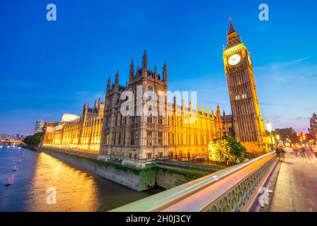 Westminster Palace and Bridge at summer night in London, UK Stock Photo