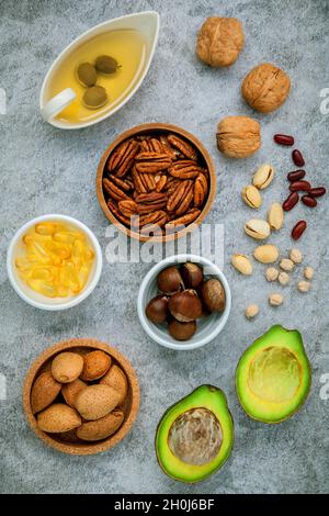 Selection food sources of omega 3 and unsaturated fats. super food high omega 3 and unsaturated fats for healthy food. Almond ,pecan ,hazelnuts,walnut Stock Photo