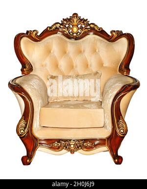 Luxurious soft armchair upholstered in expensive beige velor with mahogany wood frame, isolated on white background. Stock Photo