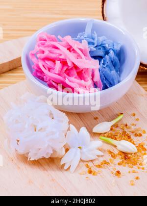 A colorful traditional coconut dessert made from grated coconut and sugar . Stock Photo