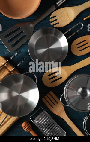 Different kitchen utensil on blue wooden background. Stock Photo