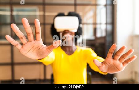 beautiful young woman with the afro haircut working in the office Stock Photo