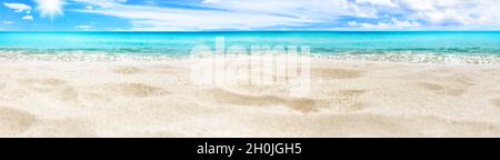 Beautiful tropical island panorama, white sand beach, turquoise sea water, ocean waves, sun blue sky clouds, blurred background, summer holidays Stock Photo