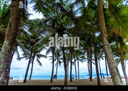 Cau Dai Beach on a nice day with tourists walking on the sand beach. Stock Photo