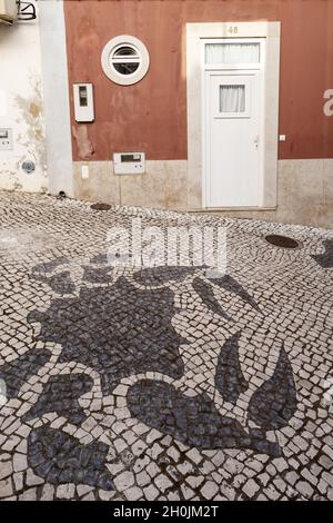 Traditional style Portuguese Calcada Pavement for pedestrian area in Lagos, Algarve, Portugal Stock Photo