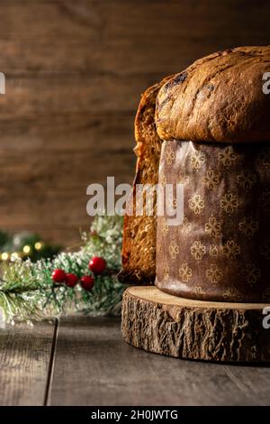 Traditional Italian panettone for Christmas on rustic wooden table Stock Photo