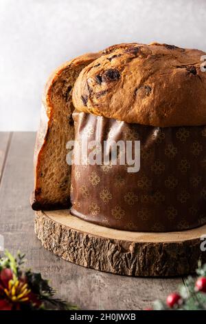 Traditional Italian panettone for Christmas on rustic wooden table Stock Photo
