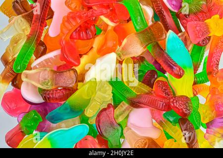 Colorful jelly gummy candies, isolated on white Assorted tasty gummy candies. Top view. Fruit gummy candies background. Multicolored jelly candies Stock Photo