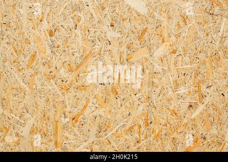 Chipboard texture background. Chipboard, particle board, engineered sheet wood made from small wood chippings. Stock Photo