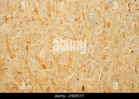 Chipboard texture background. Chipboard, particle board, engineered sheet wood made from small wood chippings. Stock Photo