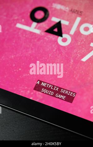 New york, USA - October 13 2021: Start watching Squid game on netflix on ipad screen close up view Stock Photo