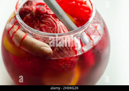 Punch prepared for Halloween party with decorative elements stylized as human organs, scary drink Stock Photo