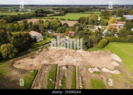 Taarstedt, Germany. 13th Oct, 2021. Employees of the State Archaeological Office work at the excavation site (aerial view with drone). During the development work for a new building area, the experts had come across a settlement from the time around 500 AD. (to dpa 'Archaeologists find 1500-year-old remains of a settlement') Credit: Frank Molter/dpa/Alamy Live News Stock Photo