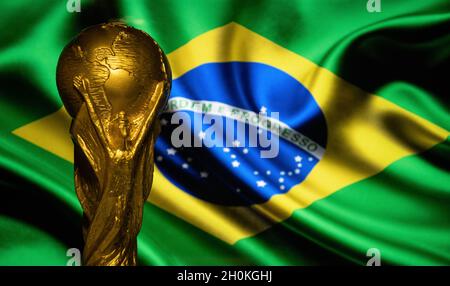 October 6, 2021 Brasilia, Brazil. FIFA World Cup on the background of the flag of Brazil. Stock Photo