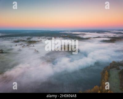 Aerial view of morning fog over the fields at Autumn Stock Photo