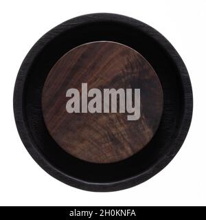 Two-color round wooden tea tray. Round wooden chopping board. Texture of old wooden planks. Stock Photo