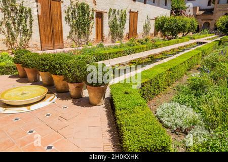 Granada, Spain - August 12, 2021: General view of The Generalife courtyard, with its famous fountain and garden. Alhambra de Granada complex Stock Photo