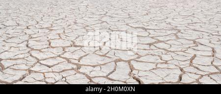 Cracked white clay, closeup surface texture, deep focus Stock Photo