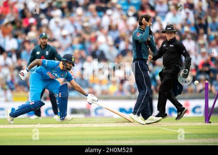 India’s Shikar Darwan is run out by England’s Ben Stokes during the third Royal London One Day International at Headingley Carnegie stadium, Leeds Stock Photo