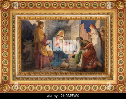 ROME, ITALY - AUGUST 31, 2021: The ceiling fresco of Adoration of shepherds in the church Chiesa del Sacro Cuore di Gesù by Virginio Monti. Stock Photo