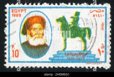 EGYPT - CIRCA 1989: stamp printed by Egypt, shows Portrait of Pasha, monument in Opera Square, Cairo, circa 1989 Stock Photo