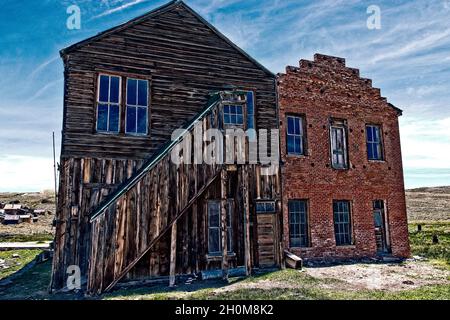 Grunge Ghost Town - The back side of a couple large buildings at the Bodie State Park ghost town in California. The image has been grunged up a little. Stock Photo