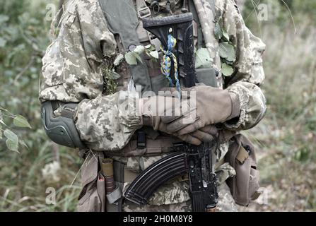 Soldier of Ukraine Ukrainian soldier with assault rifle AK Stock Photo ...