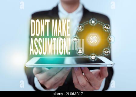 Conceptual caption Don T Make Assumption. Business idea something that you assume to be case even without proof Lady In Uniform Holding Touchpad Stock Photo