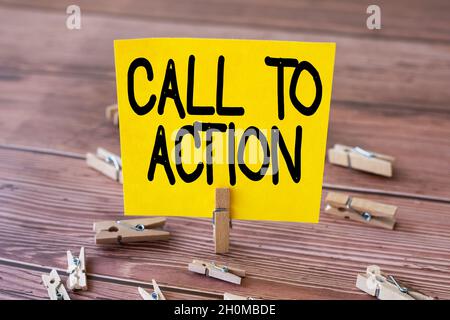 Sign displaying Call To Action. Internet Concept exhortation do something in order achieve aim with problem Blank Square Note Surrounded By Laundry Stock Photo