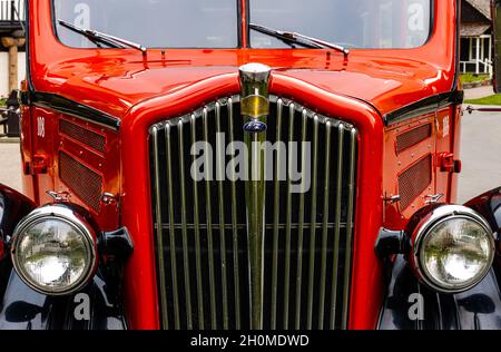 Closeup of Historic Red Bus at Lake McDonald Lodge, Glacier National Park, Montana, USA Stock Photo