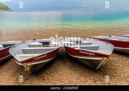 Small Fishing Boats On The Beach at Fish Creek, Glacier National Park, Montana, USA Stock Photo
