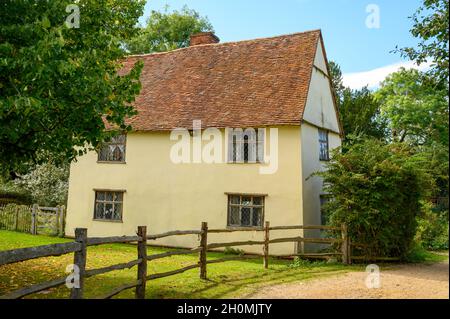 The historic cottage Willy Lott's House seen from the road near Flatford Mill in Flatford, Suffolk, England. Stock Photo