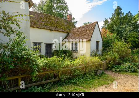 The historic cottage Willy Lott's House seen from the road near Flatford Mill in Flatford, Suffolk, England. Stock Photo