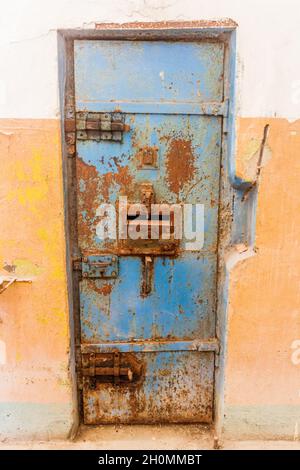 Rusty door in an old prison Stock Photo