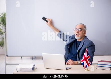 Old english language teacher in the classroom Stock Photo